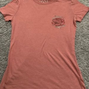 A pink/orange short sleeve crew neck t-shirt